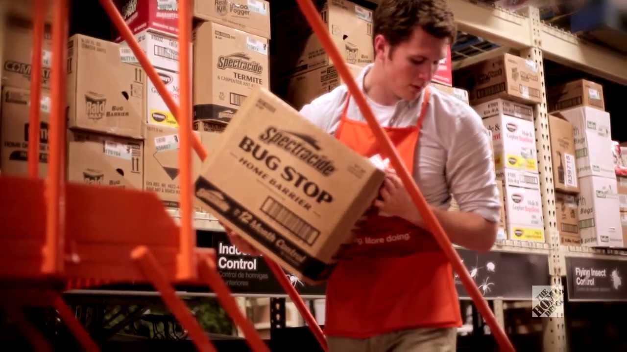 Male Home Depot employee organizing boxes