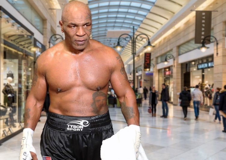 Mike Tyson, shirtless, standing menacingly in a mall
