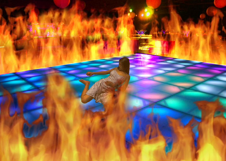 Shawty lies on a dance floor surrounded by flames.
