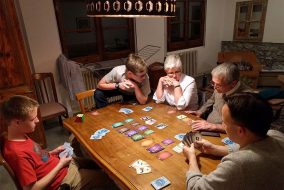 A family plays a board game.