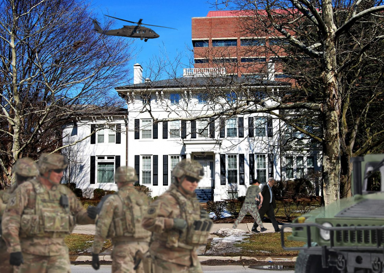 The military stands outside President Schlissel's house.
