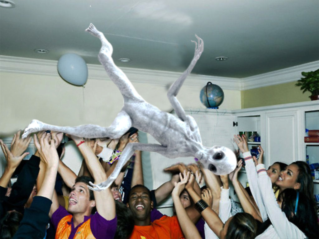 An alien crowdsurfing at a house party.