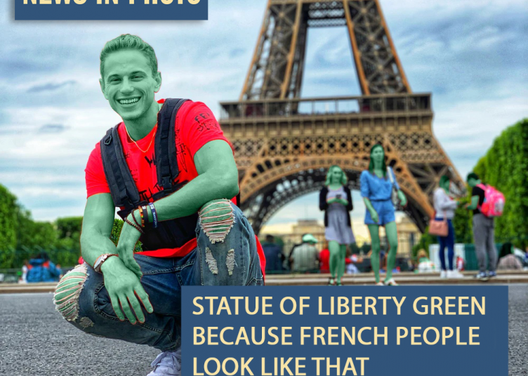 A green man in front of the Eiffel Tower with green people in the background