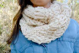 Woman wearing infinity scarf that has no noticable end point