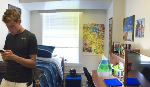 Male student standing in dorm room, photoshopped humidifier with urine