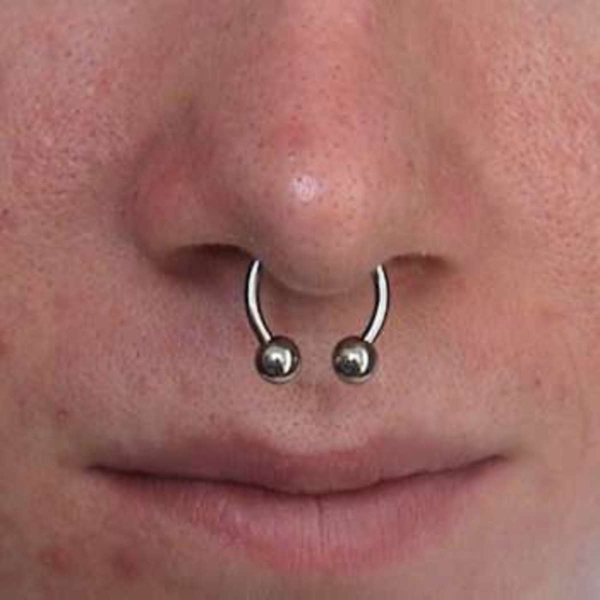 A nose with a septum piercing.