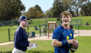 Jim Harbaugh and a football player wearing a dog collar.