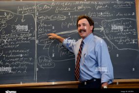 professor lecturing at a blackboard