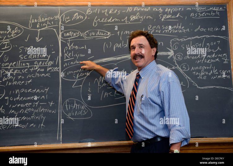 professor lecturing at a blackboard