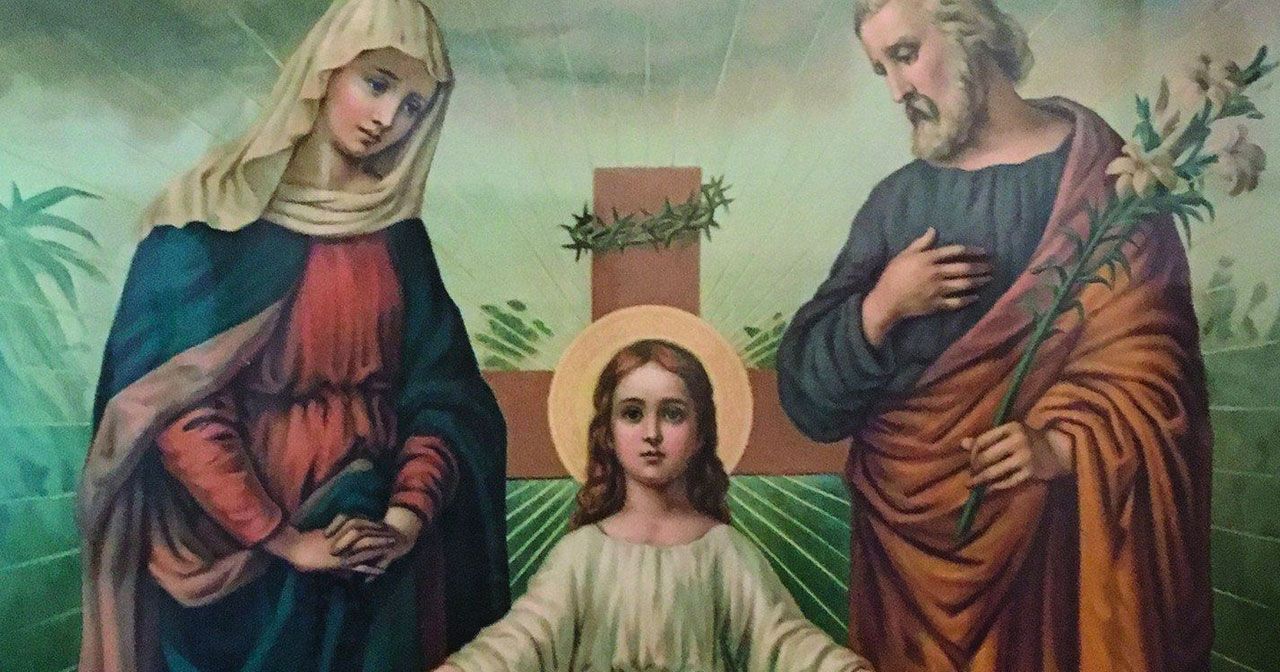 Image of a white Jesus on the cross and two overlookers