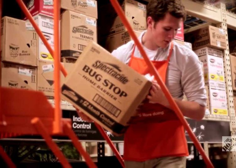Male Home Depot employee organizing boxes