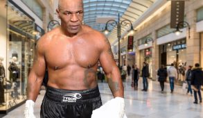 Mike Tyson, shirtless, standing menacingly in a mall