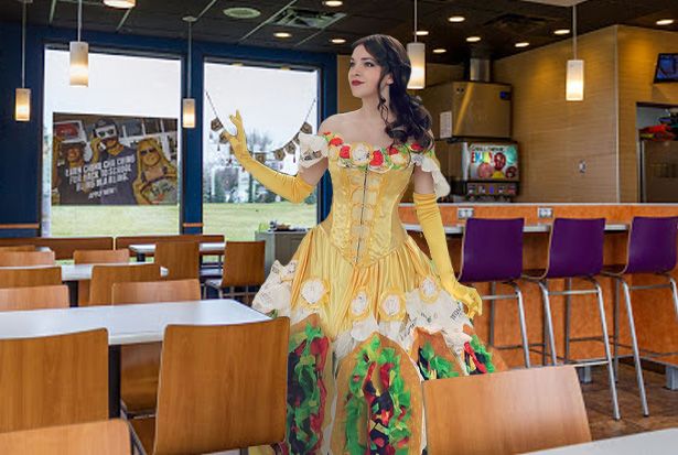 Belle from 'Beauty And The Beast' stands in a Taco Bell.