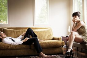 Couple in a living room after having an argument.