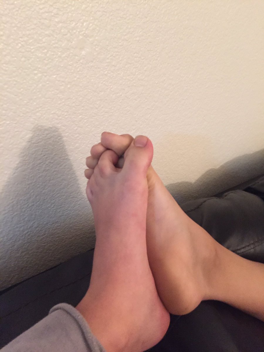 Two feet with toes locked together