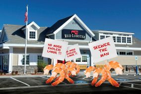 Shrimp picketting outside of a red lobster for better hours.