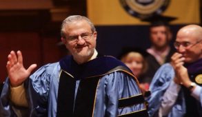 University of Michigan President Mark Schlissel in graduation robes at commencement ceremony