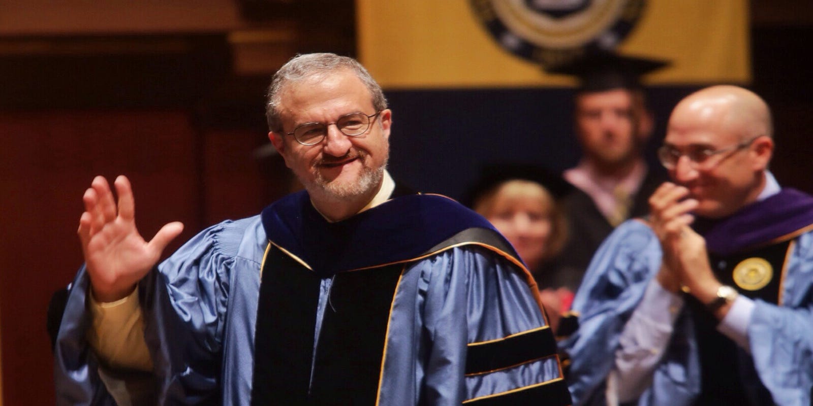 University of Michigan President Mark Schlissel in graduation robes at commencement ceremony