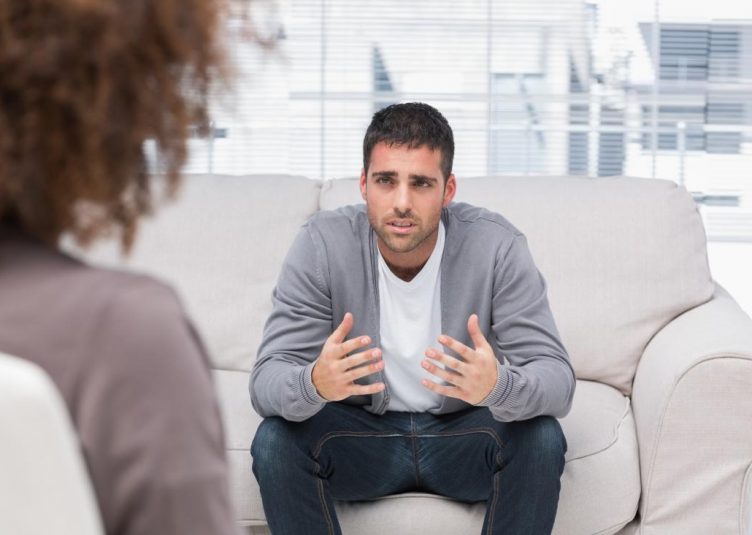 Image of a guy named bill being consoled on a couch by a therapist.