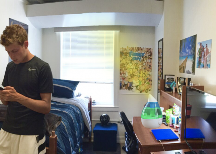 Male student standing in dorm room, photoshopped humidifier with urine