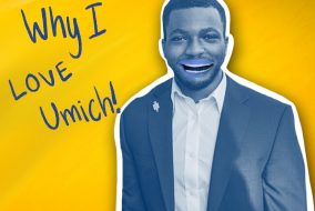 A man with way too many teeth on a yellow background and text which reads "Why I love Umich!"