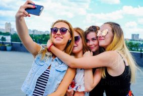 A group of girls taking a selfie.