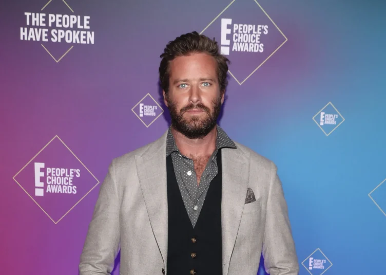 Armie Hammer poses on a People's Choice Awards red carpet.