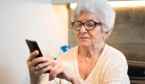 A grandma using a cell phone.