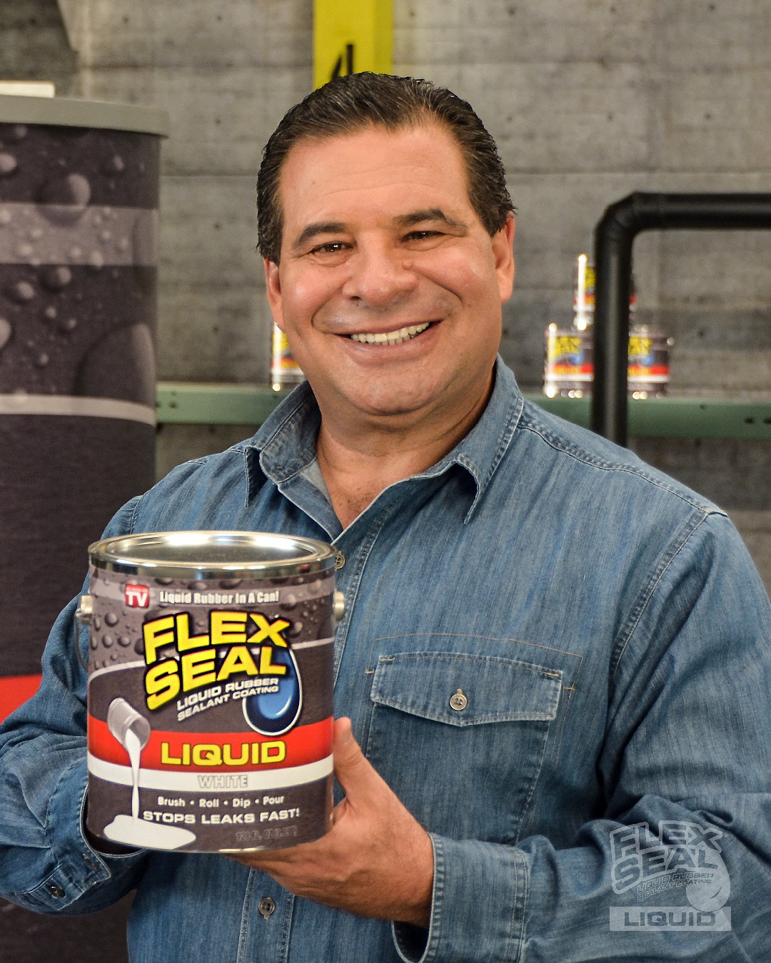 A man in a denim shirt holds up a can of liquid Flex Seal.