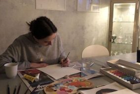A teenager studiously working on a creative art projet