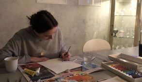 A teenager studiously working on a creative art projet