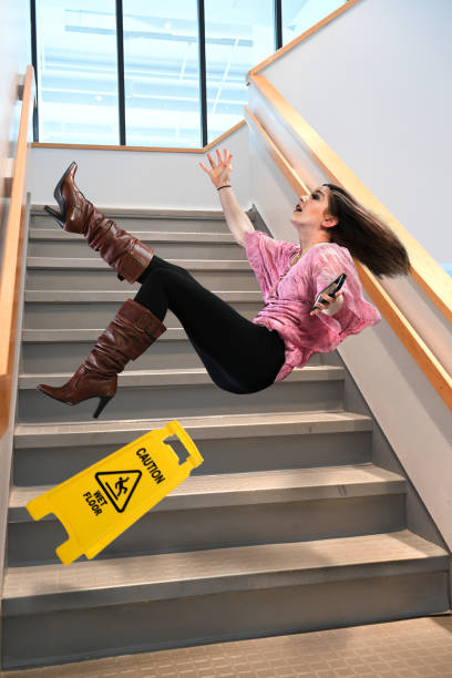 Woman falling down stairs