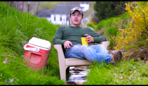 guy drinking a beer on his lawn