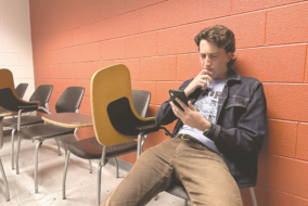 man looking at phone